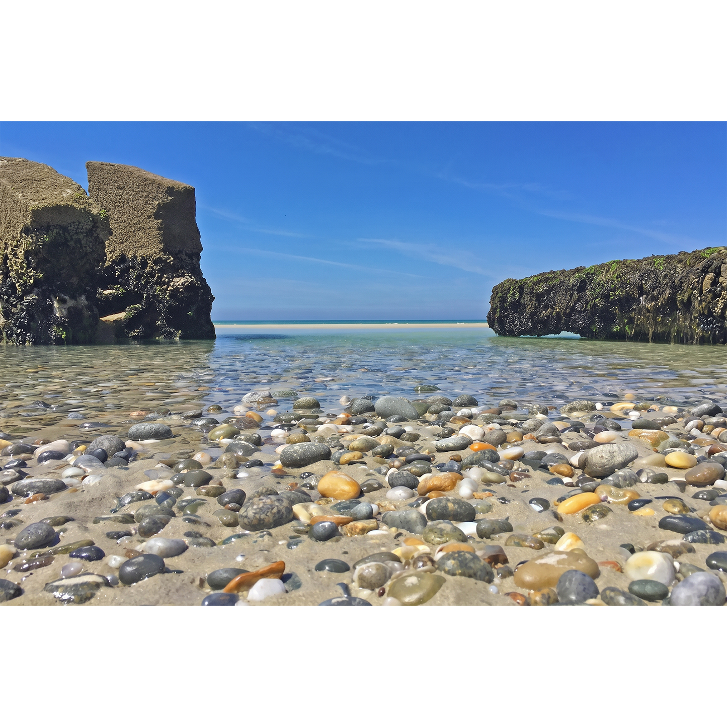 Brittany Beach Crystal Clear Shallow Waters and Pebbles