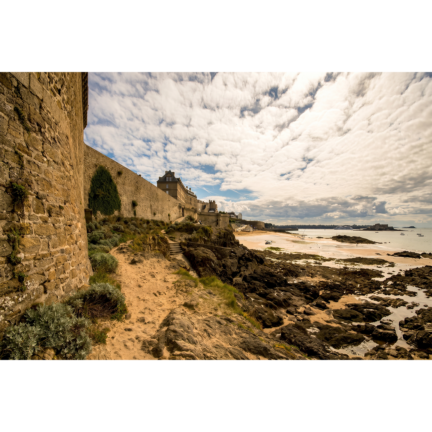 Saint-Malo - Coastal Ramparts and Low-Tide Shoreline under a Mackerel Sky