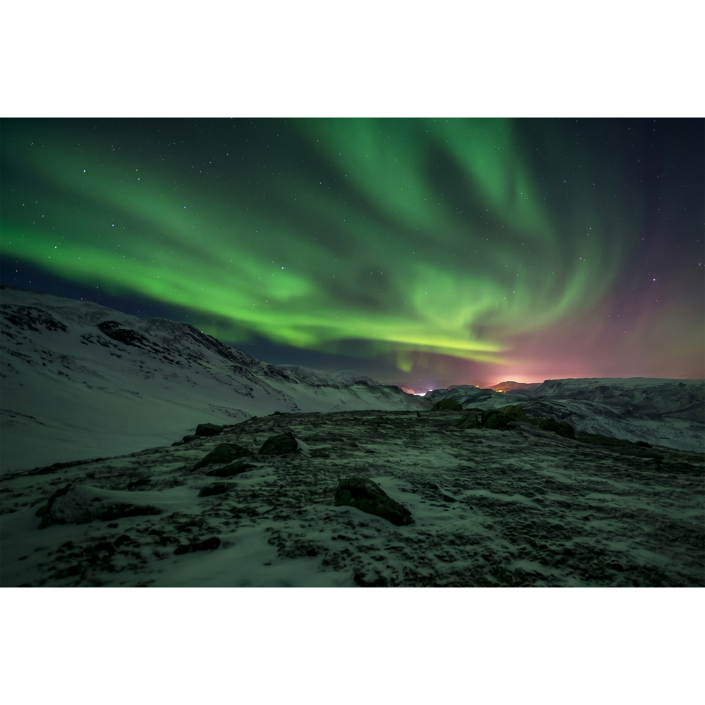 Northern Lights outside Alta - Swirling Green Aurora over a Rocky Mountain Ridge